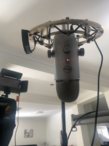Blue Yeti mic hanging from a shock mount and arm